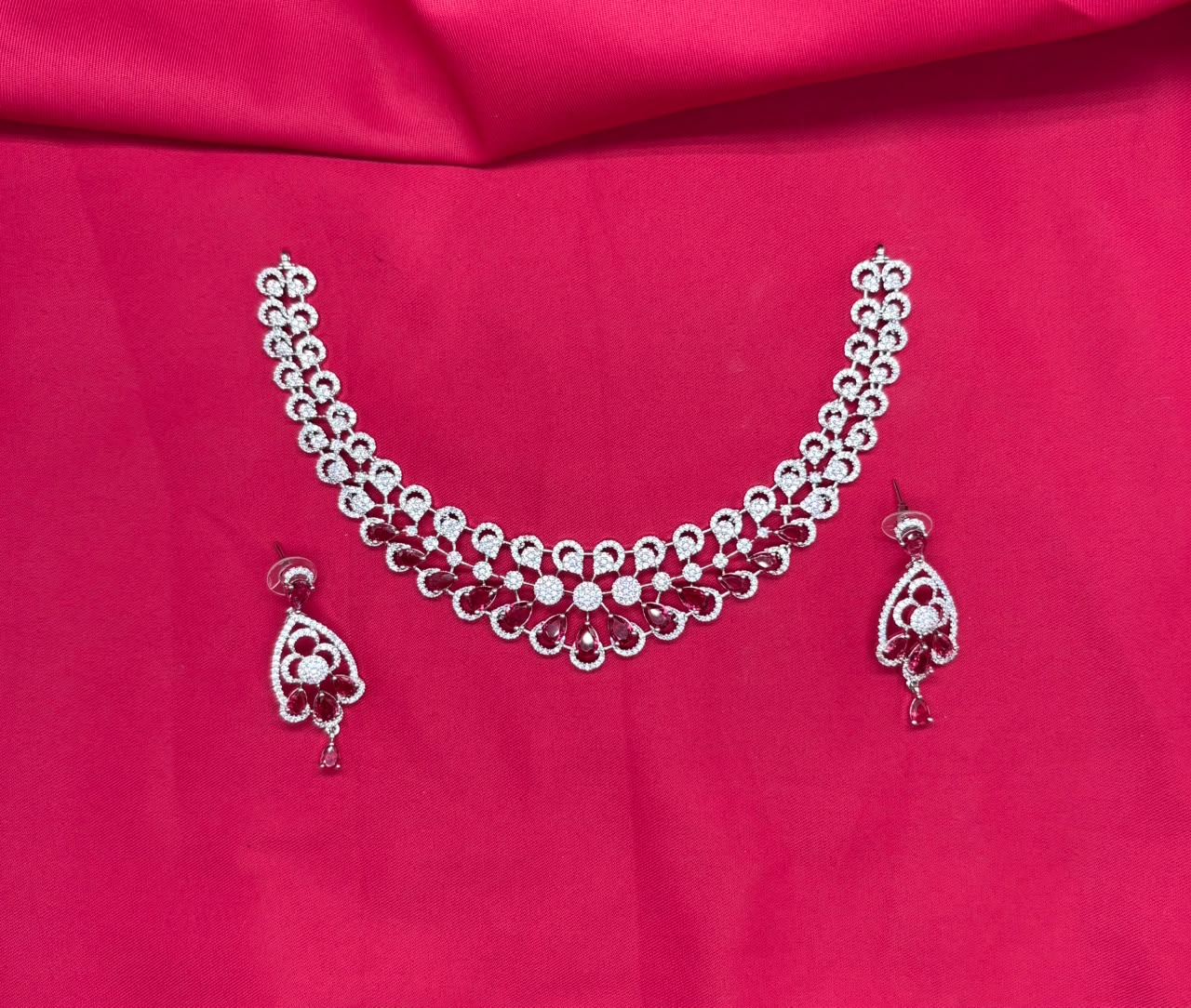 Silver finishing features white rhodium plated zircon with Red stones short Necklace
