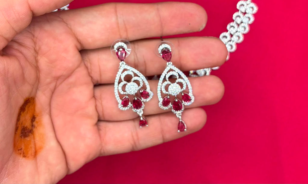 Silver finishing features white rhodium plated zircon with Red stones short Necklace