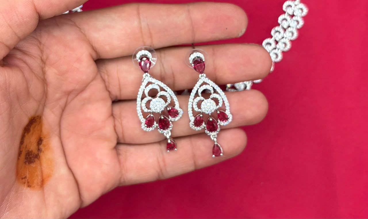 Silver finishing features white rhodium plated zircon with Red stones short Necklace