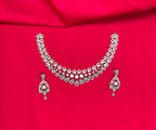 Silver finishing features white rhodium plated zircon withmint- green stones short Necklace