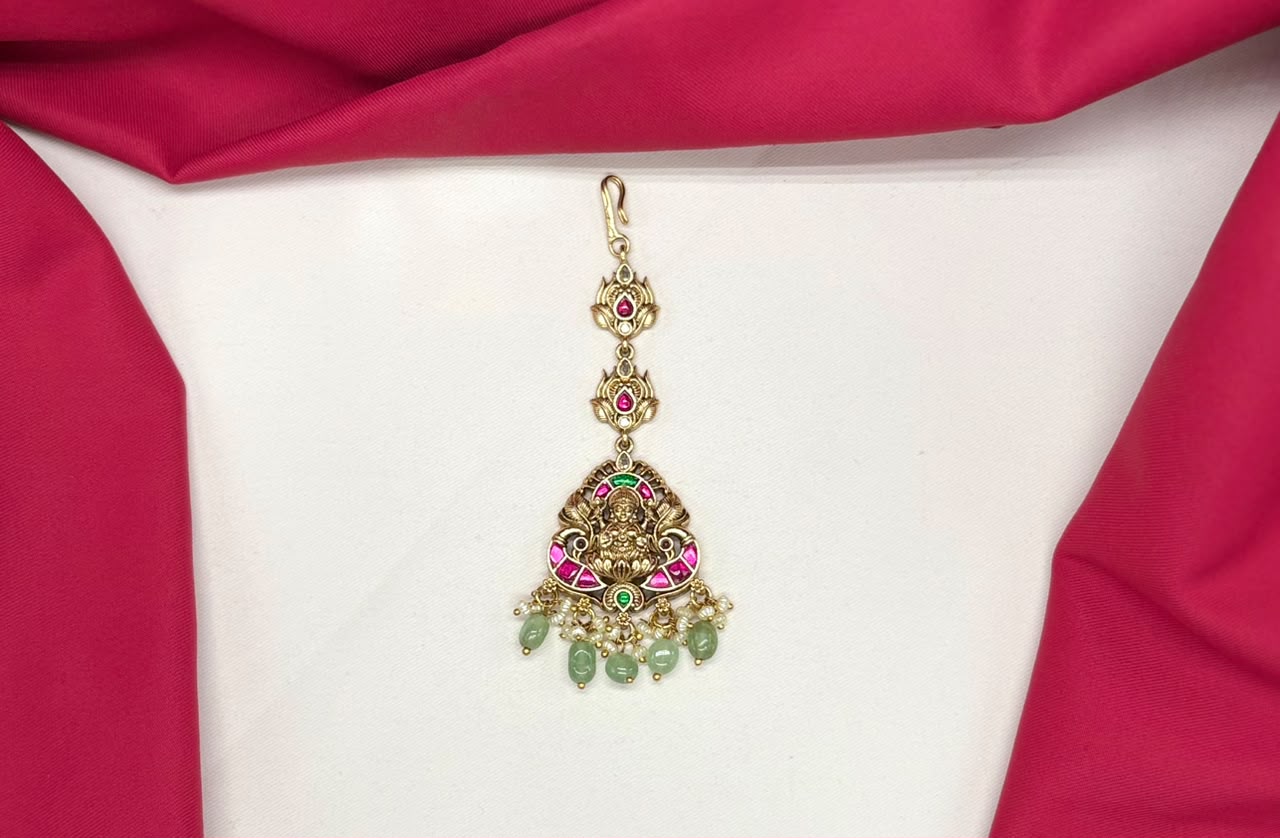 Jadau Kundan finishing lord Lakshmi with green beads Maang Tikka