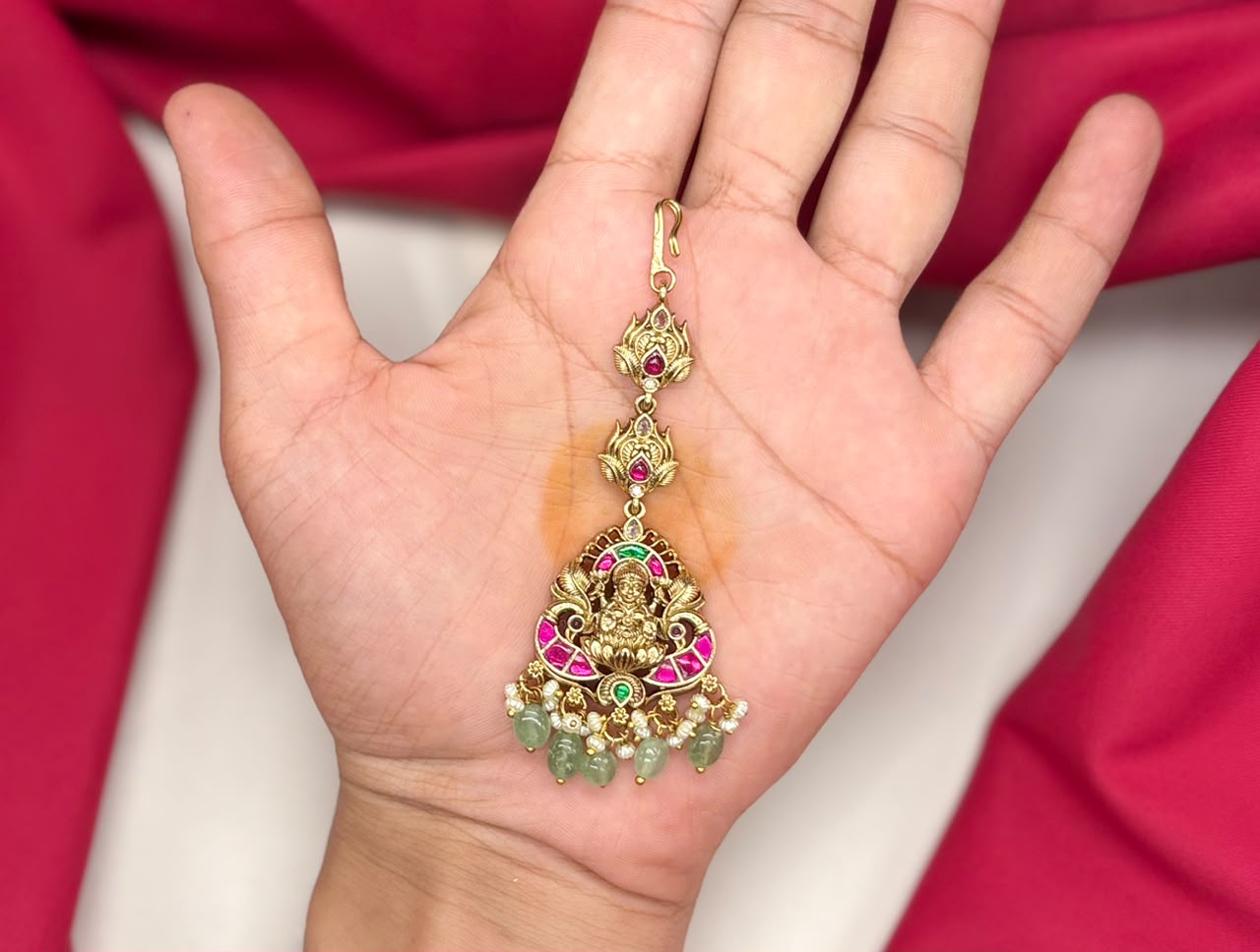 Jadau Kundan finishing lord Lakshmi with green beads Maang Tikka