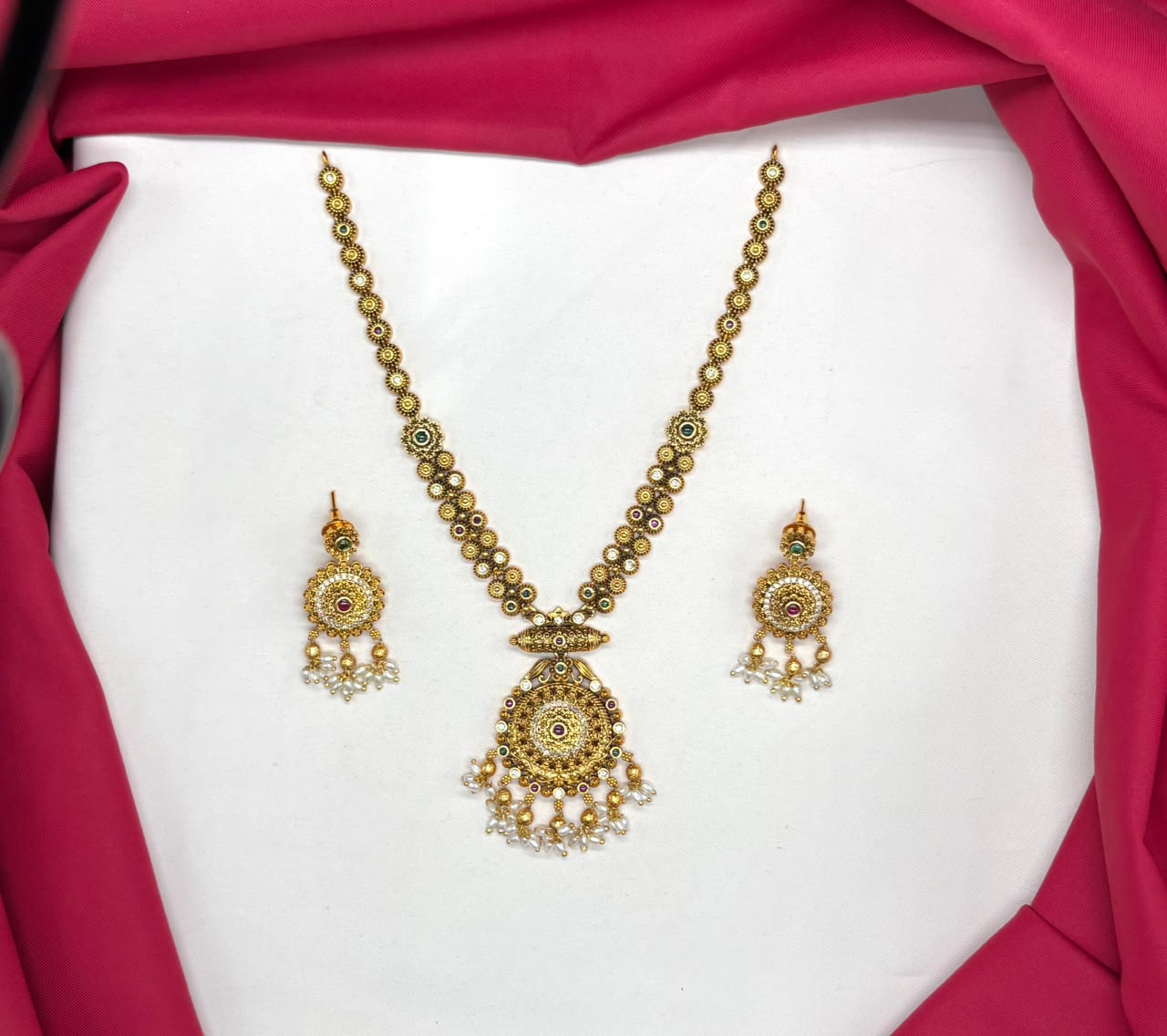Nakshi finishing features intricate multicolored stones pearl accent Short Necklace