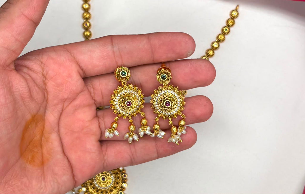 Nakshi finishing features intricate multicolored stones pearl accent Short Necklace