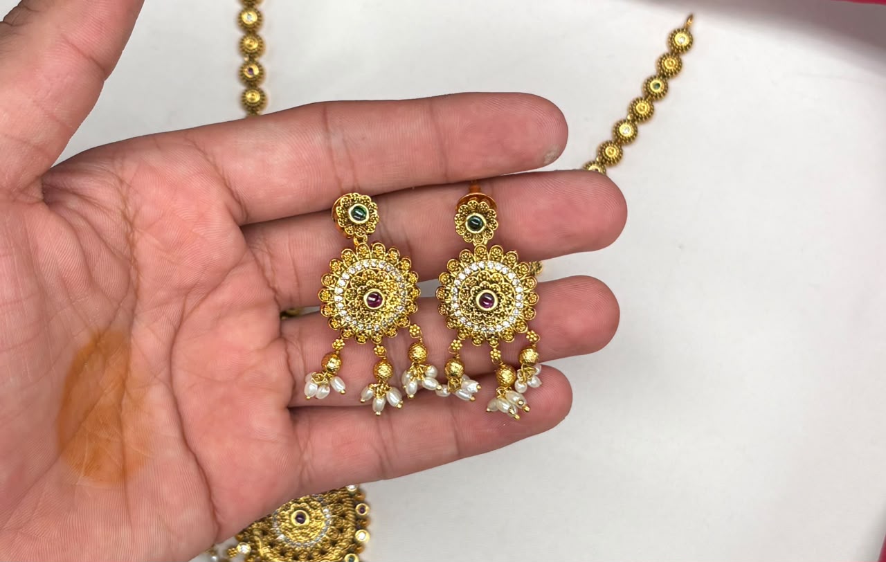 Nakshi finishing features intricate multicolored stones pearl accent Short Necklace