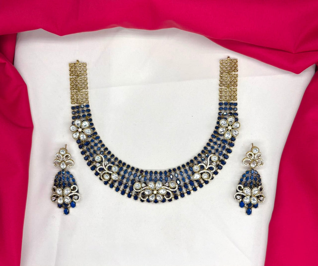Victorian finish construction adorned with blue stones and floral-shaped white crystals Necklace