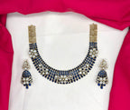 Victorian finish construction adorned with blue stones and floral-shaped white crystals Necklace