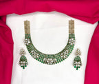 Victorian finish construction adorned with Green stones and floral-shaped white crystals Necklace