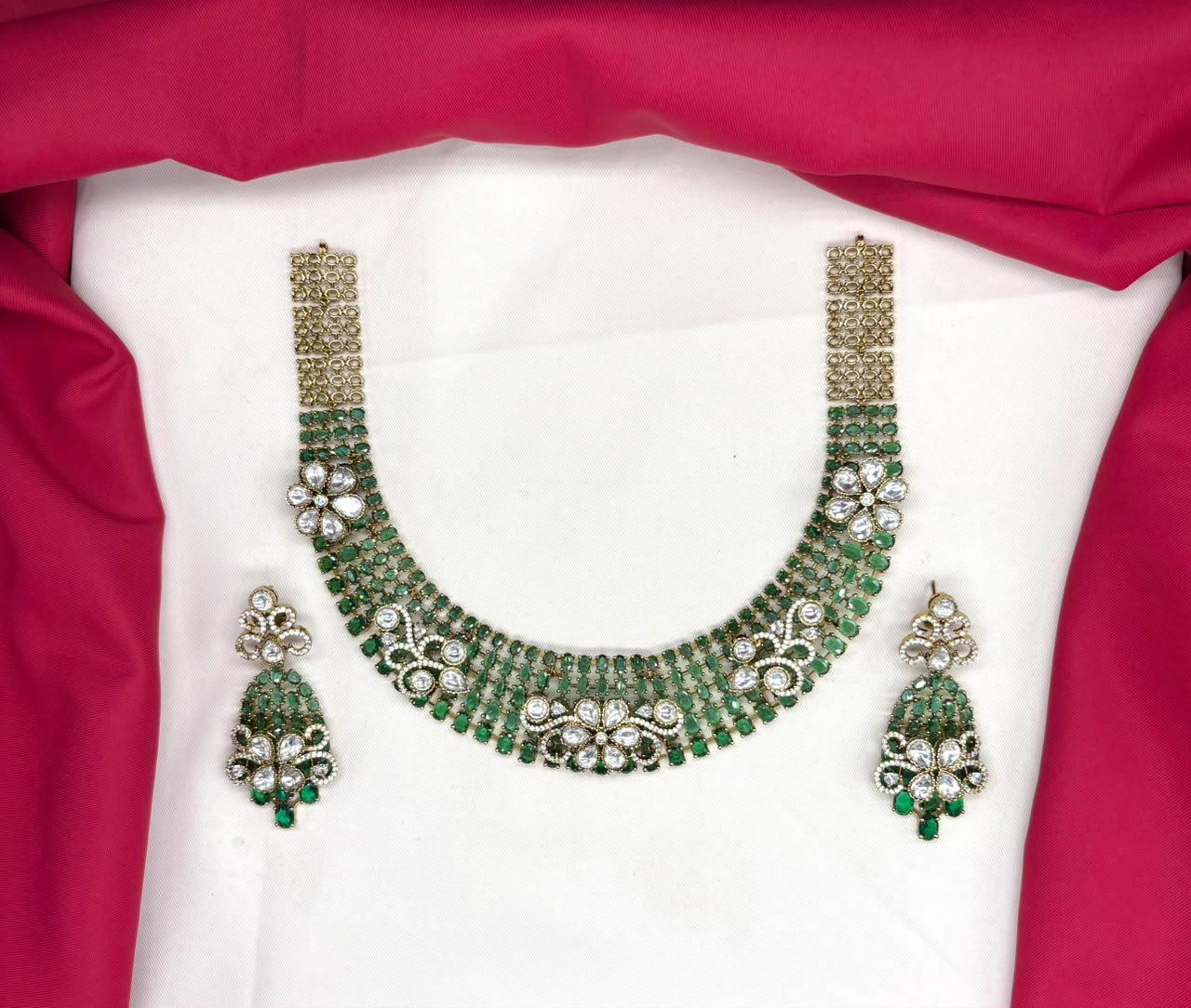 Victorian finish construction adorned with Green stones and floral-shaped white crystals Necklace