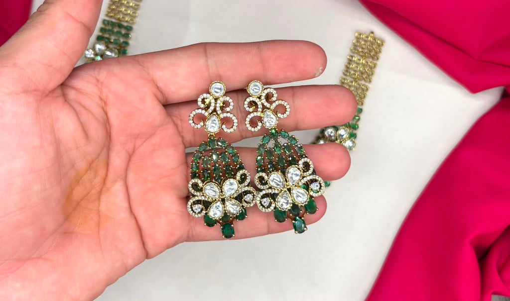 Victorian finish construction adorned with Green stones and floral-shaped white crystals Necklace