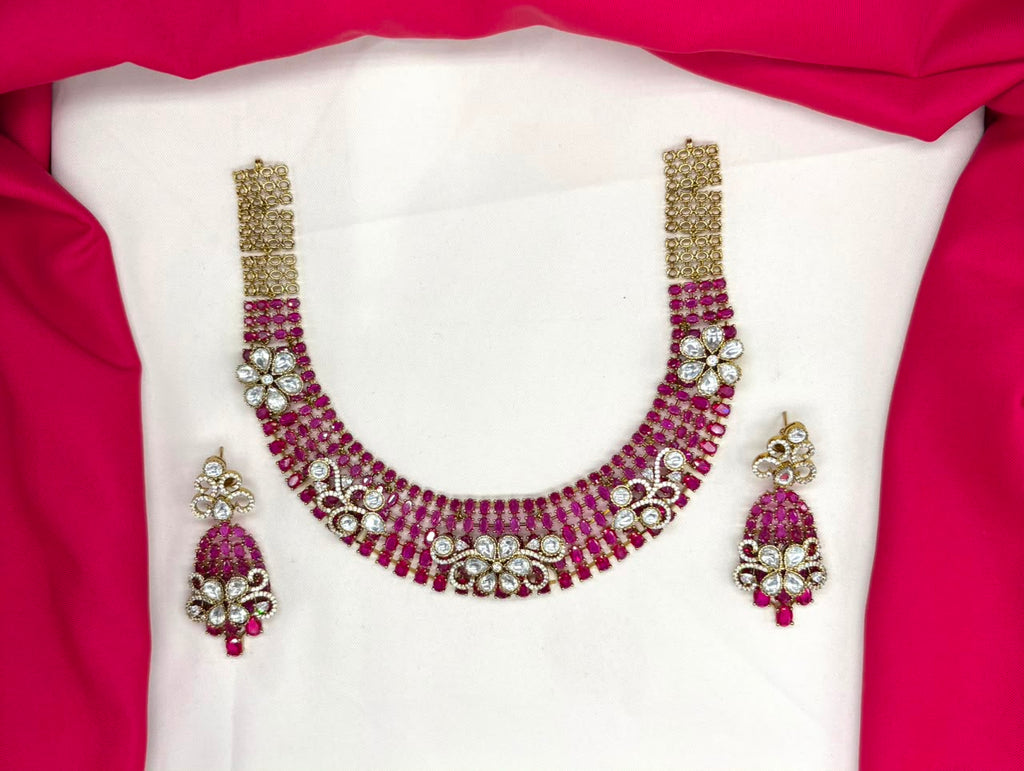 Victorian finish construction adorned with Pink stones and floral-shaped white crystals Necklace