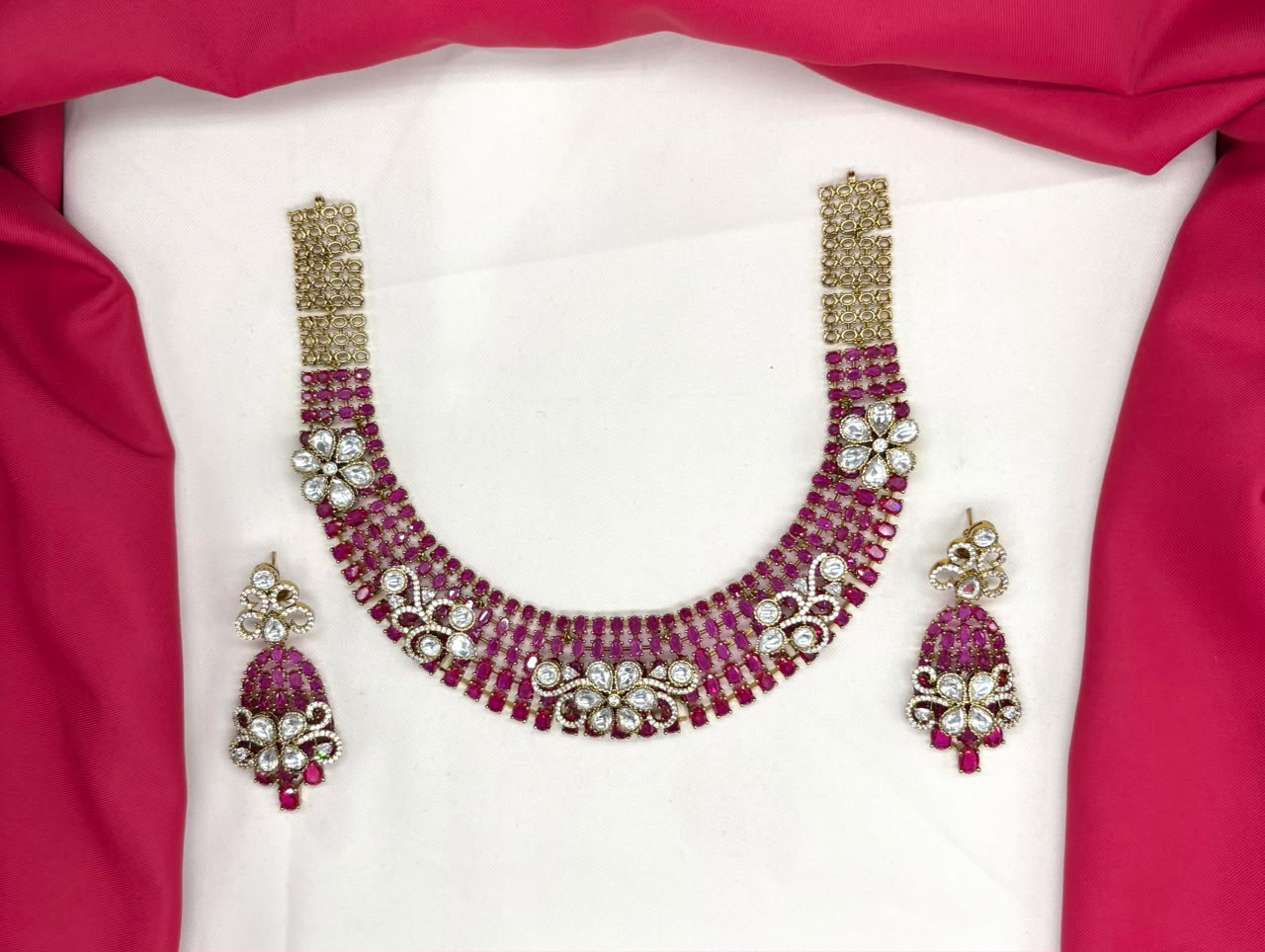 Victorian finish construction adorned with Pink stones and floral-shaped white crystals Necklace