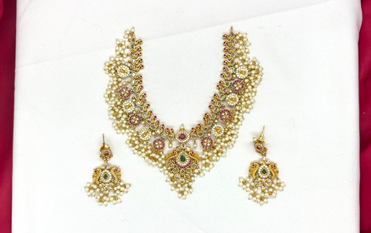 Nakshi finishing with Gold  plating with white pearls