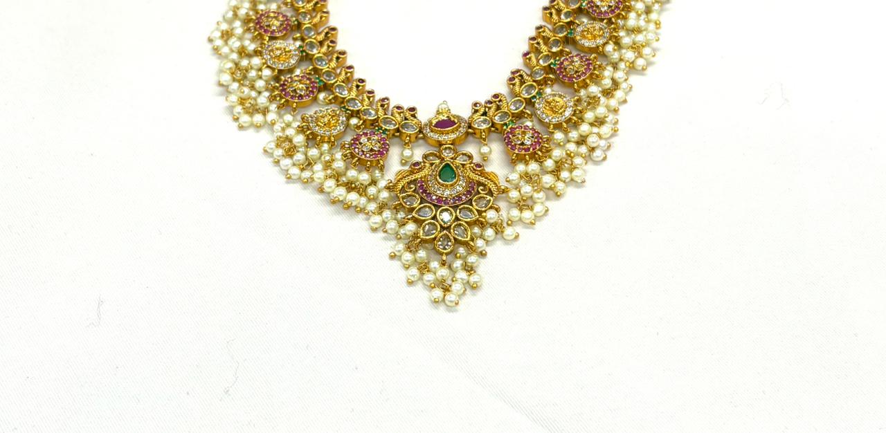 Nakshi finishing with Gold  plating with white pearls