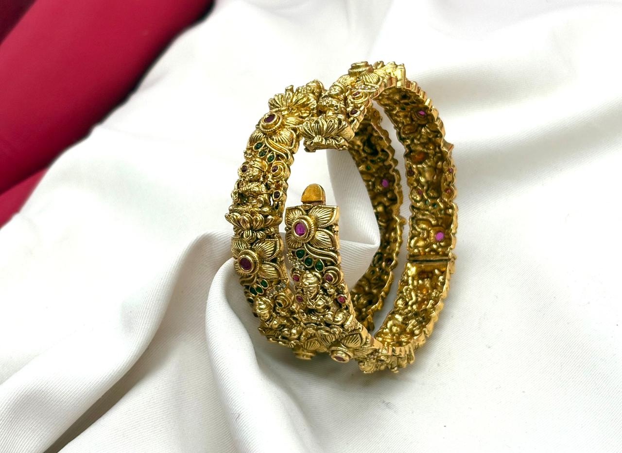 Matte finishing floral motifs with lord lakshmi stones accents