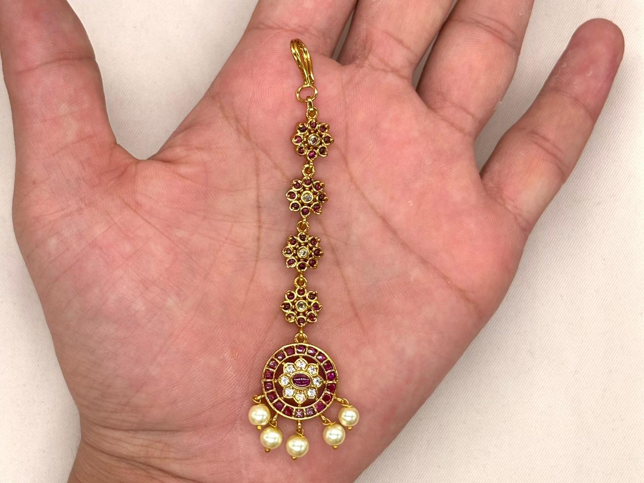 Ruby-colored emerald stone pearl drop maang tikka