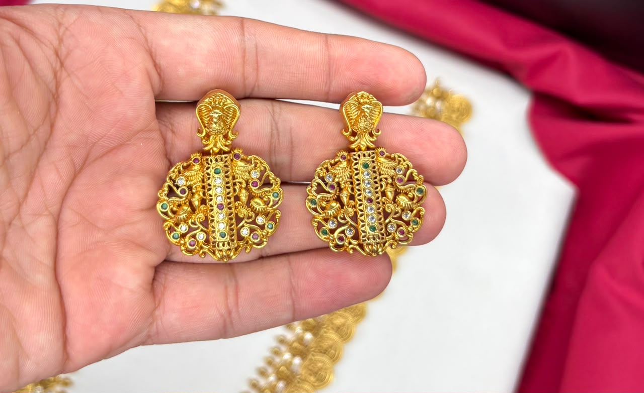 Matte finishing temple set features a long Lakshmi coin design haram necklace