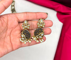 premium features intricate blue bead detailing and prominent kundan stone Necklace