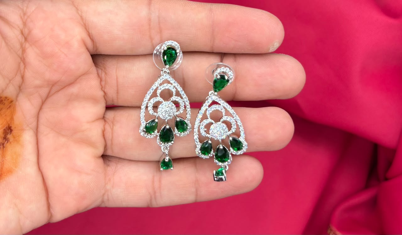 Silver finishing features a white rhodium plated zircon with green stones short necklace