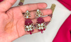 Victorian finish construction adorned with Pink stones and floral-shaped white crystals Necklace