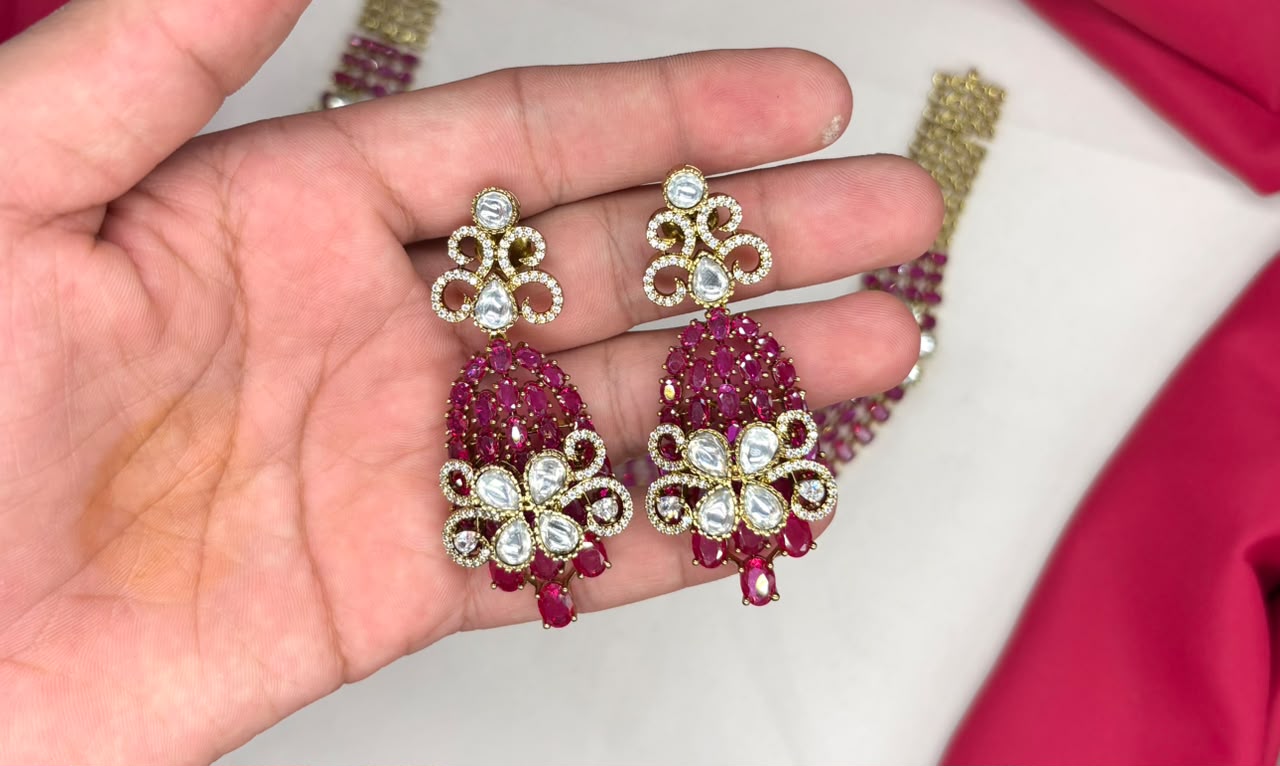 Victorian finish construction adorned with Pink stones and floral-shaped white crystals Necklace